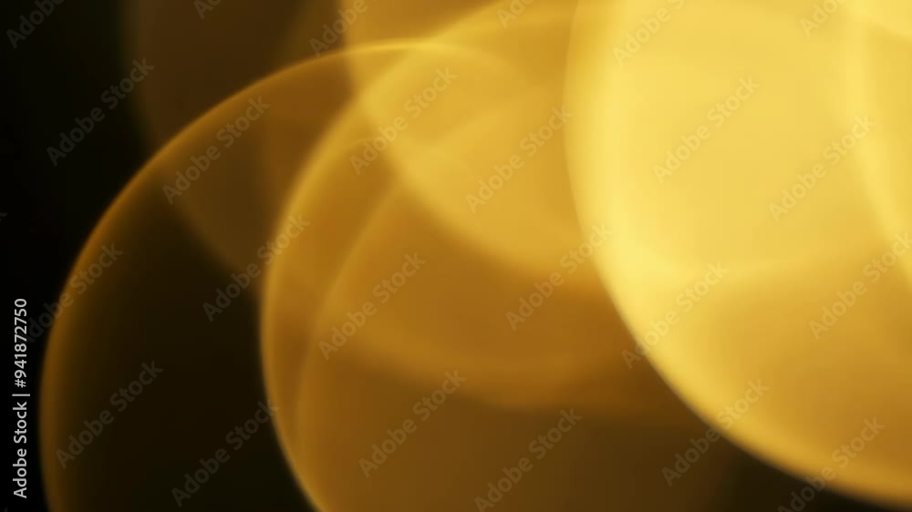 Gold abstract light flow with soft bokeh effect on black background