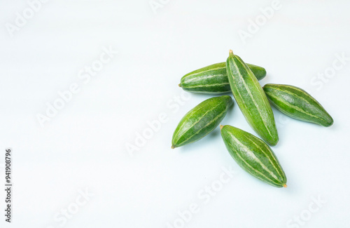 Potol is a small, green, Pointed Gourd that is native to India, also called Parval in Hindi and Putulika in Sanskrit.   It is a vital summer vegetable in Bangladesh and West Bengal. Pointed Gourd. photo