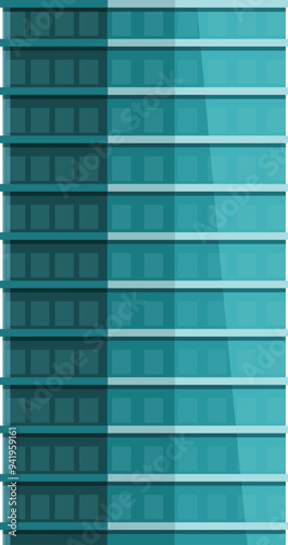 Tall, modern skyscraper with reflective glass windows stands tall against a clear sky
