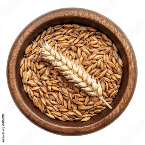 wheat grain and Ear in wooden bowltop view isolated on white background photo