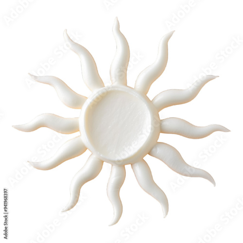 Sun shaped composition made of white cream on the background
