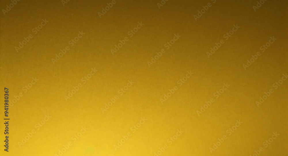 Gold wall texture background. Yellow shiny gold foil paint on wall surface with light reflection Gold wall texture background. Yellow shiny gold foil paint on wall surface with light reflection
