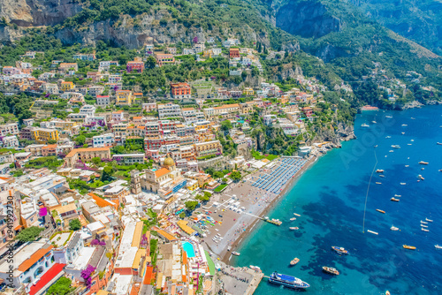 Positano town, beach and beautiful colorful houses on the cliff in Amalfi coast in Italy