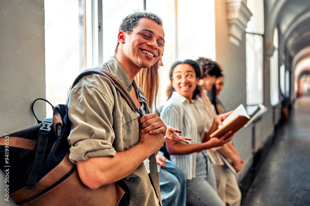 Obraz premium Portrait of happiness african american boy at university. Male student, smile and notes for knowledge at college, academy scholarship for school.