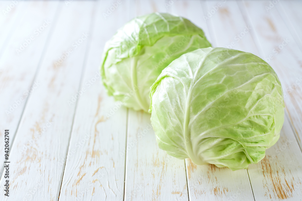 fresh cabbage on a light wooden table, selective focus. fresh cabbage on a light wooden table, selective focus.