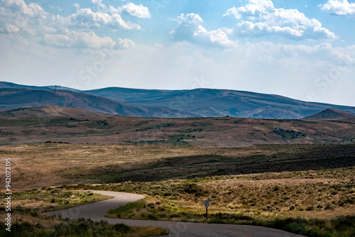 Wallpaper Mural A road in Fossil Butte National Monument leads into Fossil Butte Valley, winding past Dynamic Lake in Wyoming's unique landscape and geological features. Torontodigital.ca