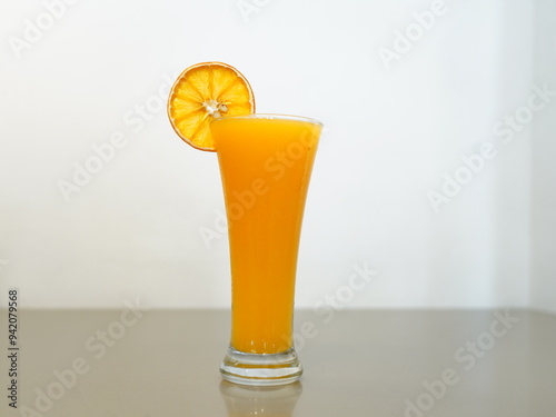 fresh orange juice cup on table