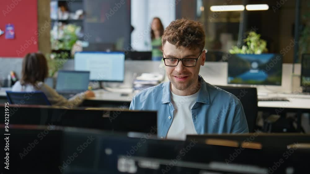 Smiling programmer typing keyboard working computer at office workplace closeup
