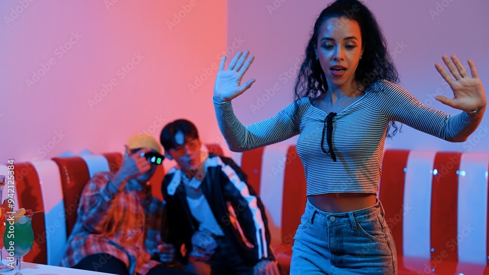 Hispanic dancer perform movement while diverse friend sitting and dancing together. Happy professional hipster moving hand while multicultural group supporting and encouraging friend. Regalement. Hispanic dancer perform movement while diverse friend sitting and dancing together. Happy professional hipster moving hand while multicultural group supporting and encouraging friend. Regalement.