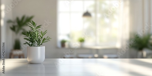 An elegantly serene Scandinavian interior features a carefully placed potted plant on a stylish table, complemented by a softly blurred background that together create a calm and inviting atmosphere