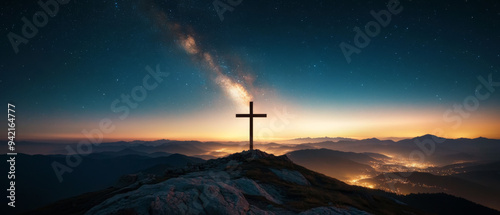 A cross is on a mountain top at night