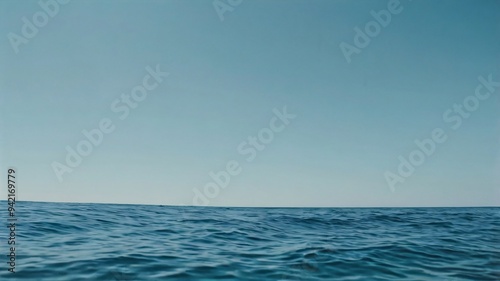 Wallpaper Mural The view offers a peaceful seascape with gentle waves reflecting the light blue sky. The vast horizon stretches endlessly, creating a serene and calm atmosphere Torontodigital.ca