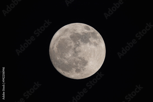 Obraz na płótnie photograph of the full moon partially covered with clouds w salonie