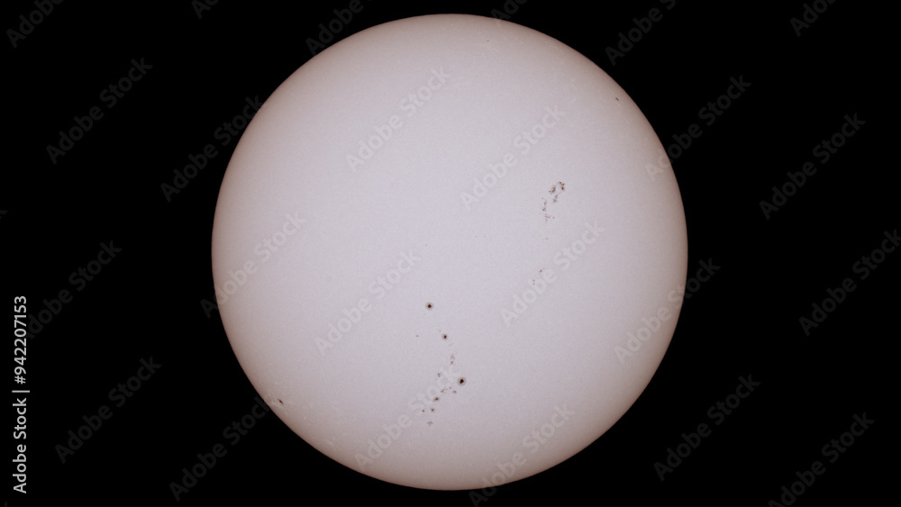 photograph of the sun made with a reflex camera, sunspots are observed