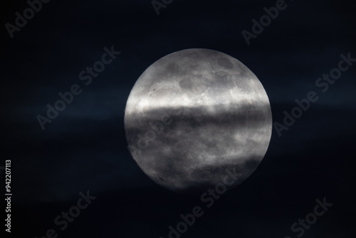 Obraz na płótnie photograph of the full moon partially covered with clouds w salonie