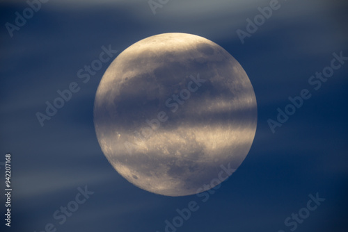 Obraz na płótnie photograph of the full moon partially covered with clouds w salonie