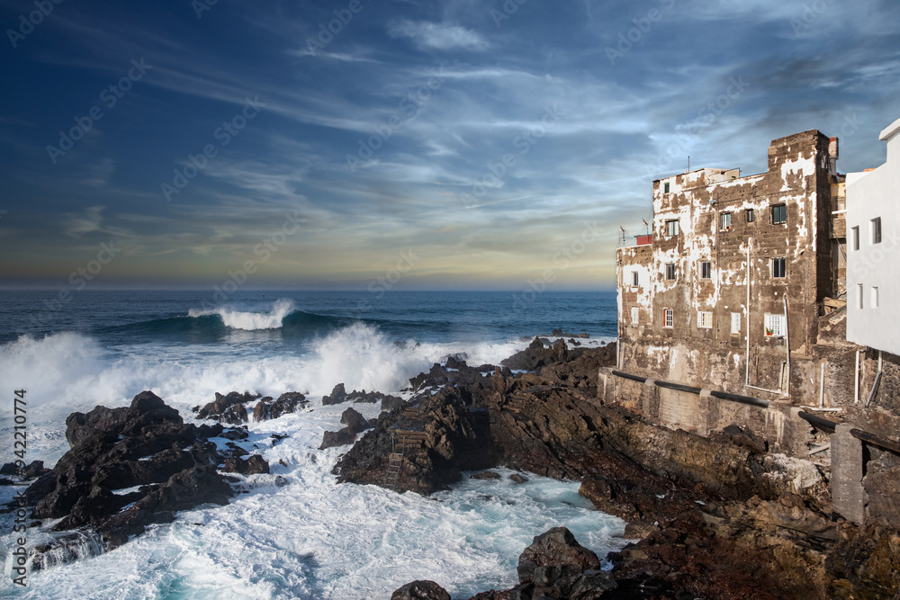 Old weathered buildings on ocean coastline, Punta Brava, Tenerife Old weathered buildings on ocean coastline, Punta Brava, Tenerife