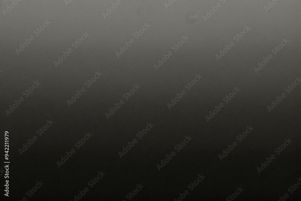 Black background made of real, shiny black paper covered with foil, illuminated by a soft light from above. Black background made of real, shiny black paper covered with foil, illuminated by a soft light from above.