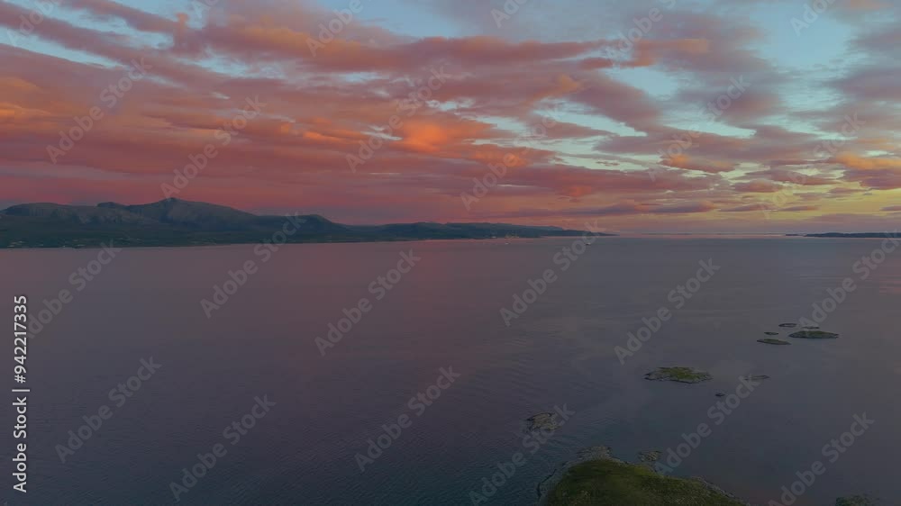 Scenic sunset at Hitra island fjord, Norway with colorful clouds and blue sea water. Nature landscape. Scenic sunset at Hitra island fjord, Norway with colorful clouds and blue sea water. Nature landscape.