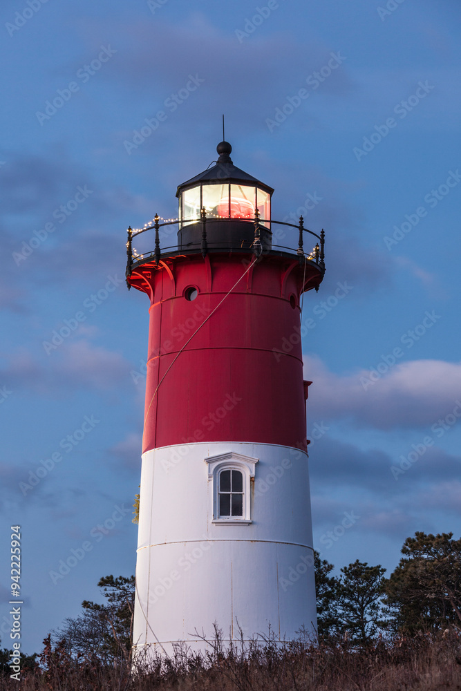 USA, Massachusetts, Cape Cod, Eastham. Nauset Light with Christmas wreath at dawn. USA, Massachusetts, Cape Cod, Eastham. Nauset Light with Christmas wreath at dawn.