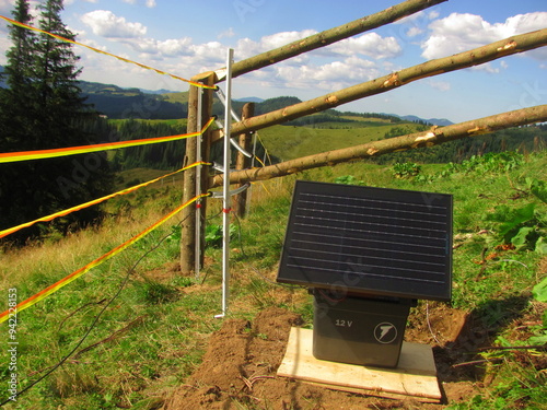 Electric fence system with solar panel installed on a farm