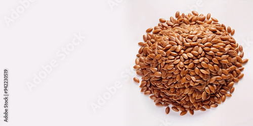A mound of small, shiny, brown flax seeds. The seeds are shown in detail, with the simplicity of the background allowing the texture and color of the seeds to stand out