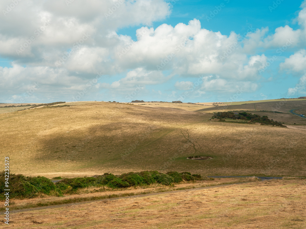 Peaceful Countryside Landscape with Rolling Hills and Blue Sky Peaceful Countryside Landscape with Rolling Hills and Blue Sky