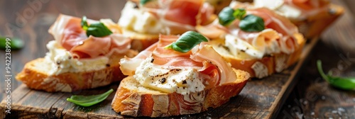 Delicious crostini topped with creamy cheese and prosciutto, a classic Italian appetizer.