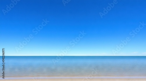 Wallpaper Mural   A sandy shore next to a large body of water sits atop a sandy beach, featuring a distant boat Torontodigital.ca