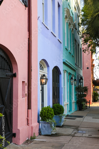 Charleston, South Carolina, USA. Row homes with multi-colored pastel colored paints in historic district of Charleston.
