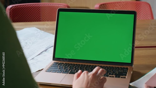 Employee using greenscreen touchpad on computer at remote workplace closeup photo