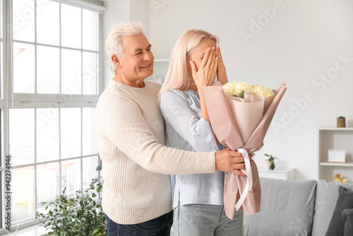Mature man greeting his wif...