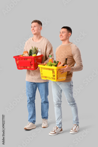 Young men with full shoppin...