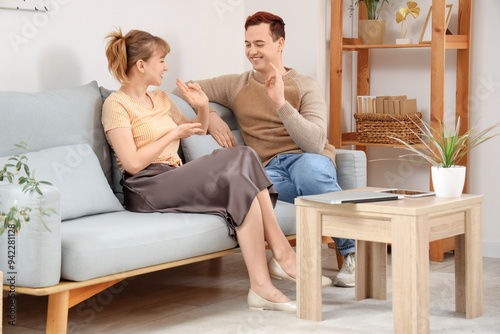 Young deaf mute couple usin...