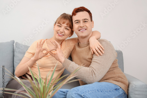 Happy young couple making h...