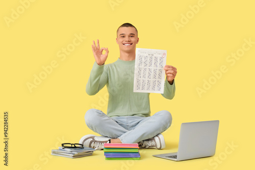 Happy male student with res...