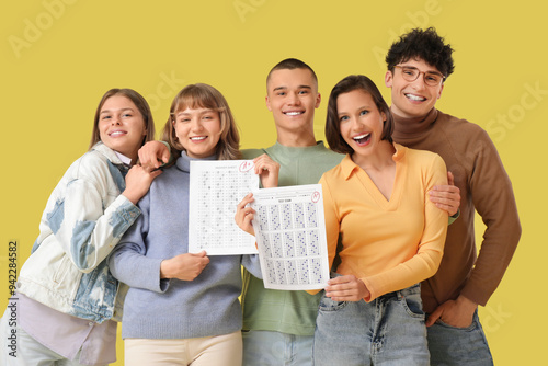 Happy diverse students hold...