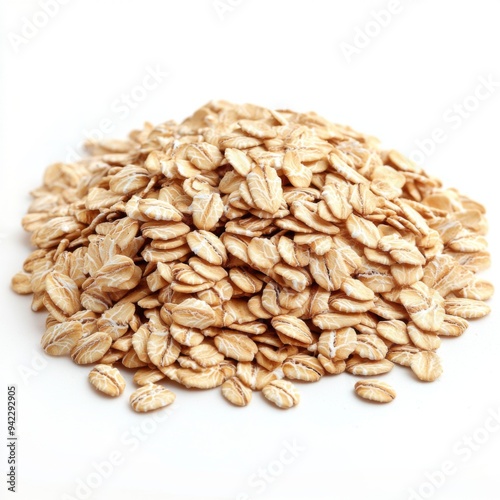 A close-up shot of a pile of rolled oats isolated on a white background.