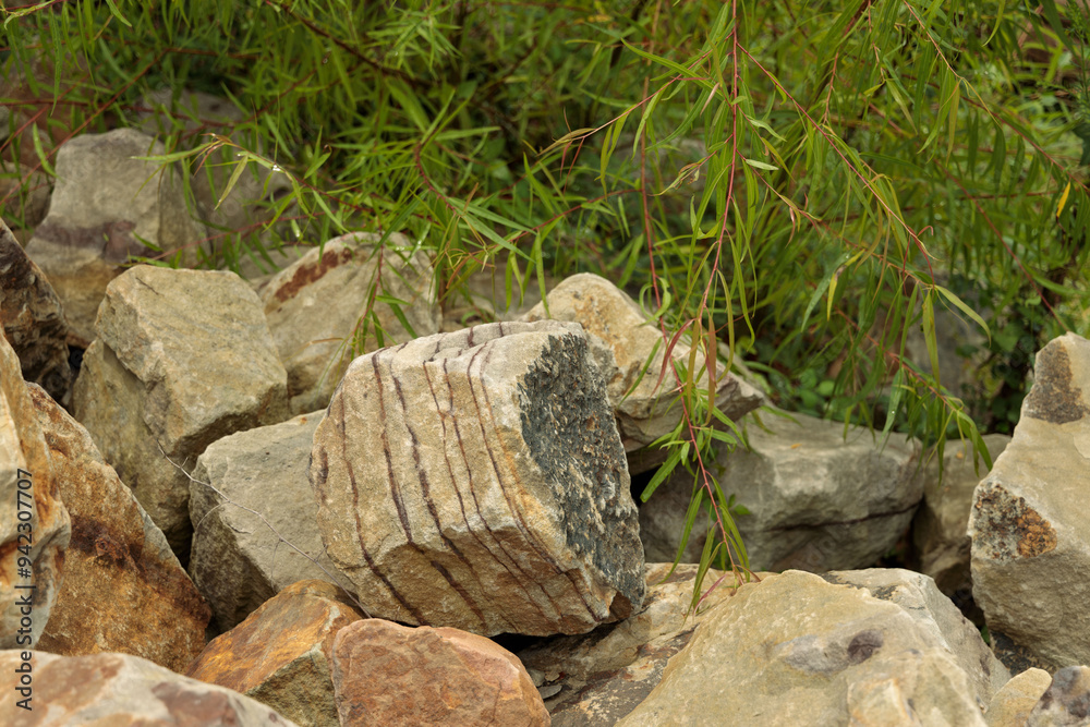 Rocks with sediment lines lying in a pile Rocks with sediment lines lying in a pile