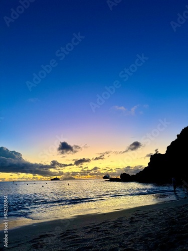 sunset over the mountains on the beach