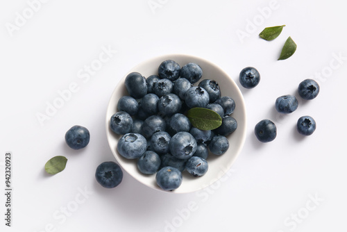 Bowl with fresh ripe blueberry on white background, closeup