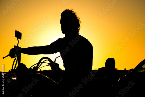 silhouette of biker and sunset