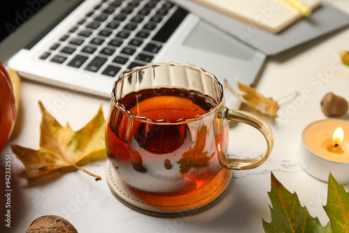 Warm tea mug on coaster wit...