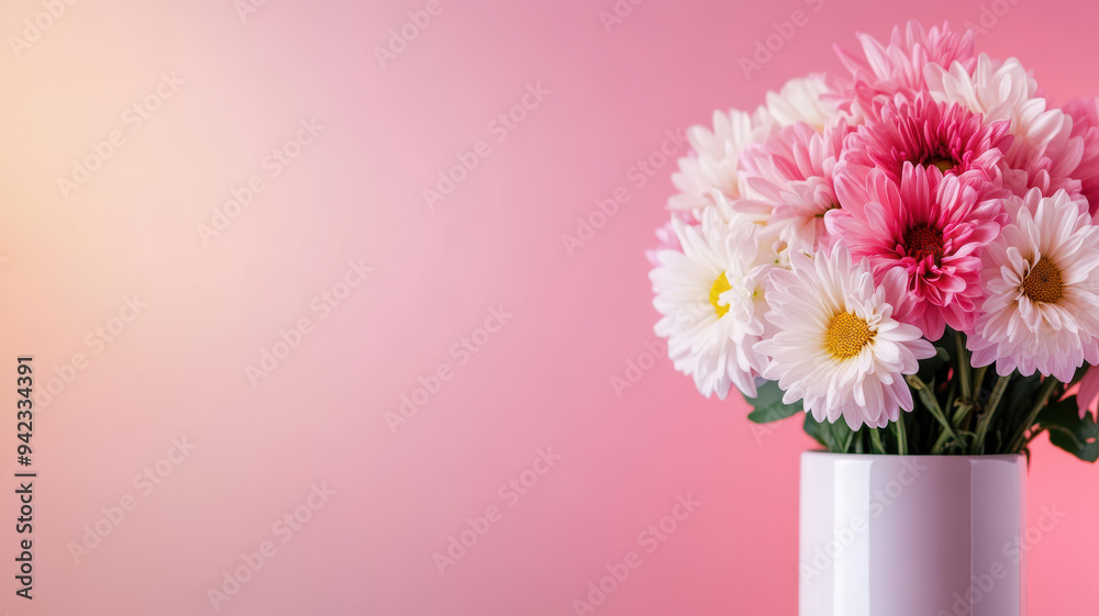 Fototapeta premium A vase of flowers sits on a pink background