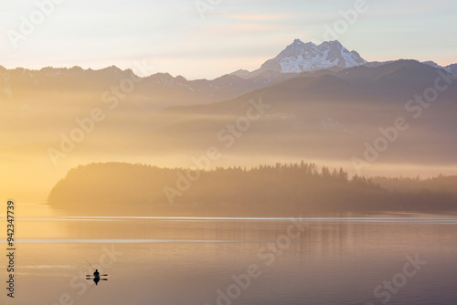 USA, Washington State, Seabeck. Fishing at sunset on Hood Canal at sunset. photo