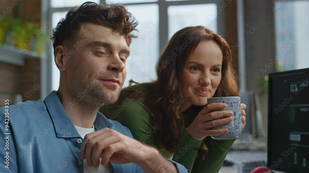 Two colleagues drinking coffee at desk closeup. Office team working open space Two colleagues drinking coffee at desk closeup. Office team working open space