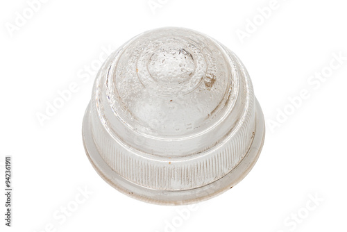 Studio photography of a white headlight isolated on a white background. Close-up shot of a vintage passenger indicator light. Used auto part, classic circular shape.