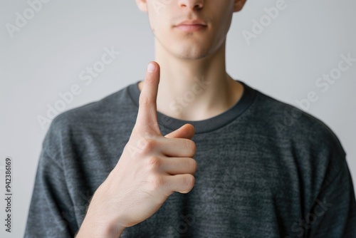 A person showing approval with a thumbs up gesture