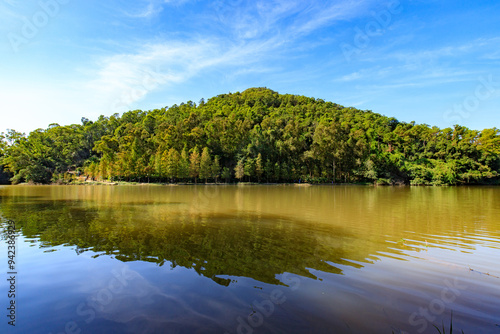 Serene Lake with Verdant Hills Reflecting in Water, Lau Shui Heung Reservoir, Hong Kong photo