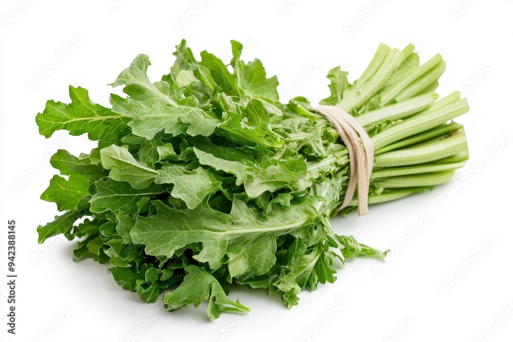 A bunch of fresh green leafy vegetables tied together. A bunch of fresh green leafy vegetables tied together.